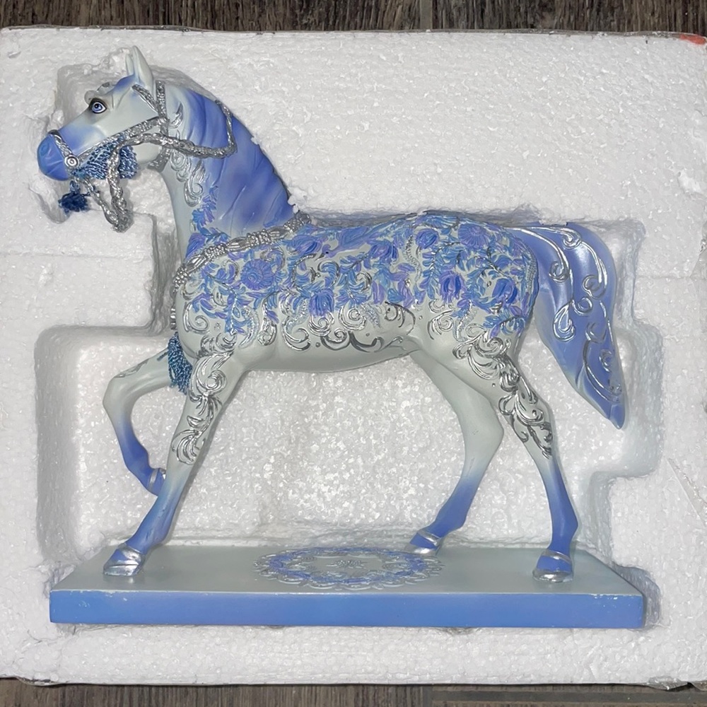 The trail of Painted Ponies retired holiday crystal horse figurines.